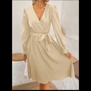 Woman’s belted dress